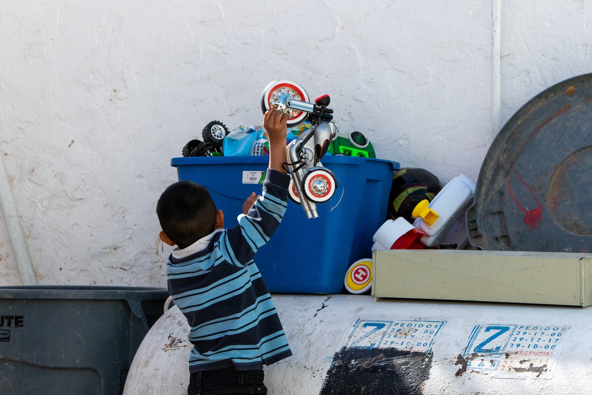 Diego chooses a toy from a box in El Buen Samaritano shelter in Juárez.