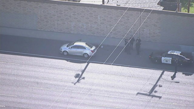 Police at the scene of a road rage shooting in California that killed a child.