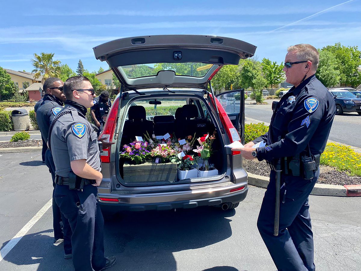 Fairfield, California, police officers deliver flowers on Mother's Day after arresting the delivery driver for driving under the influence.