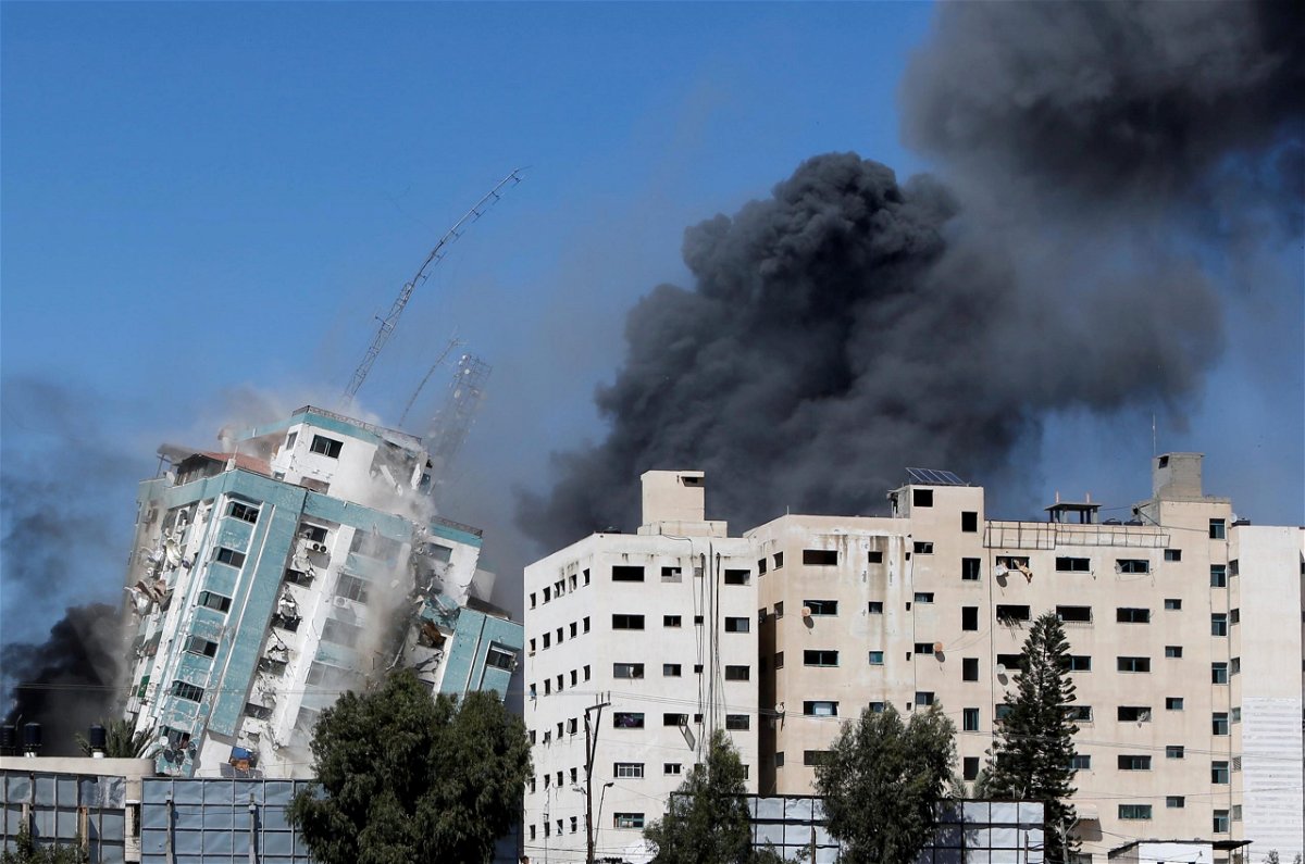 A tower housing AP, Al Jazeera offices collapses after Israeli missile strikes in Gaza city.