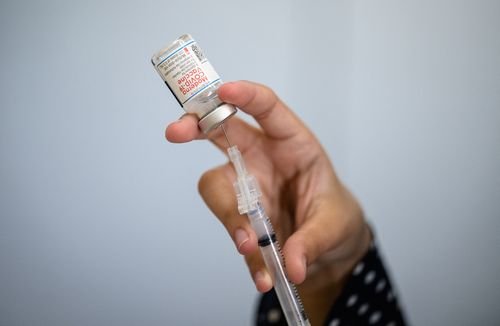 A syringe is loaded with Covid-19 vaccine.