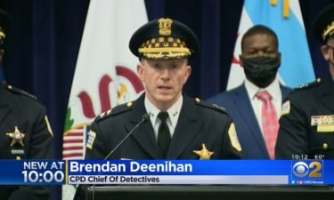 Chicago Police Chief of Detectives Brendan Deenihan (center) called the shooting death of a 24-year-old victim "almost execution-style."