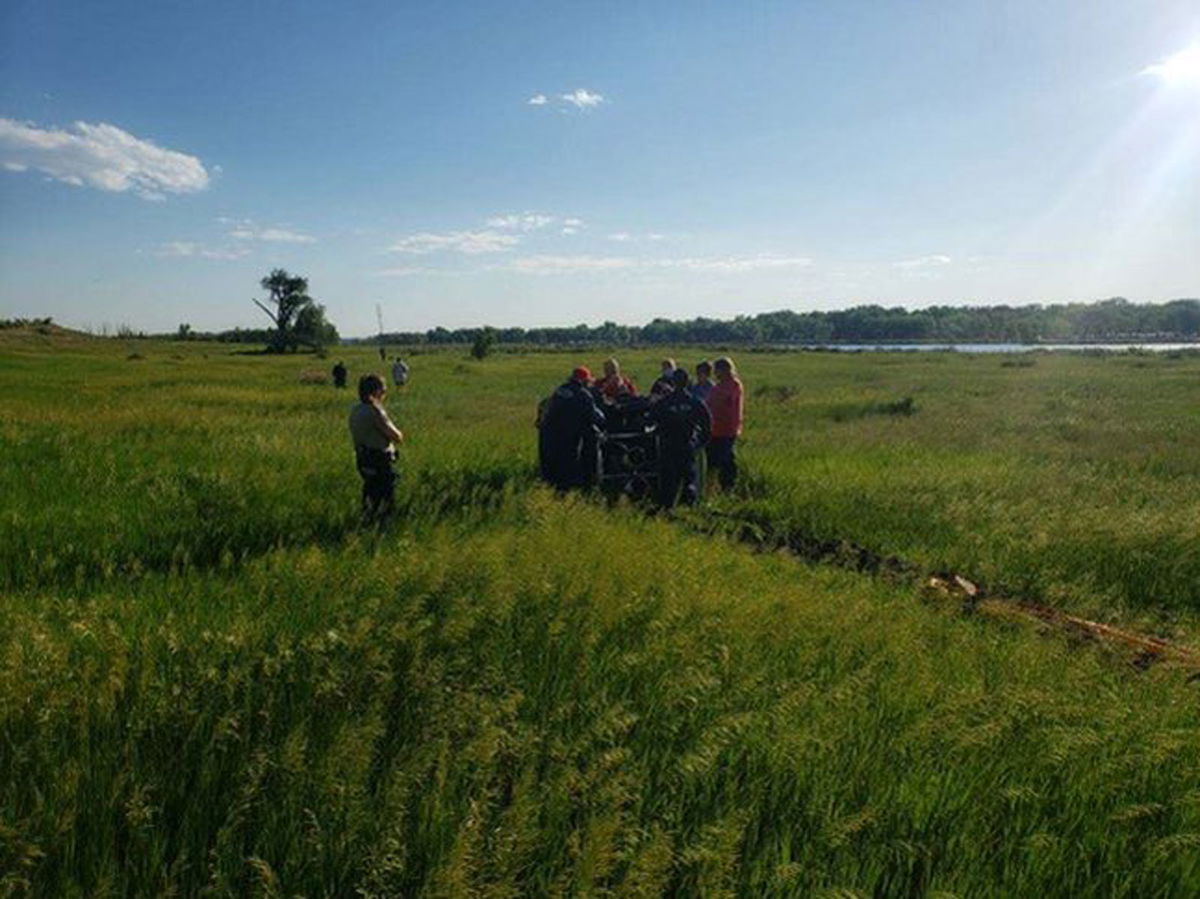 A group gathered in a state park where a hot air balloon crashed.