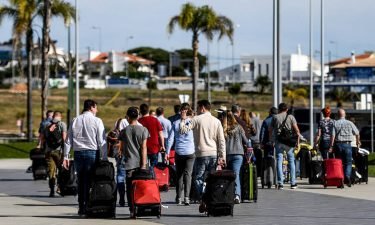 Travelers from the UK arrive in Portugal on the first day of post-restriction travel.