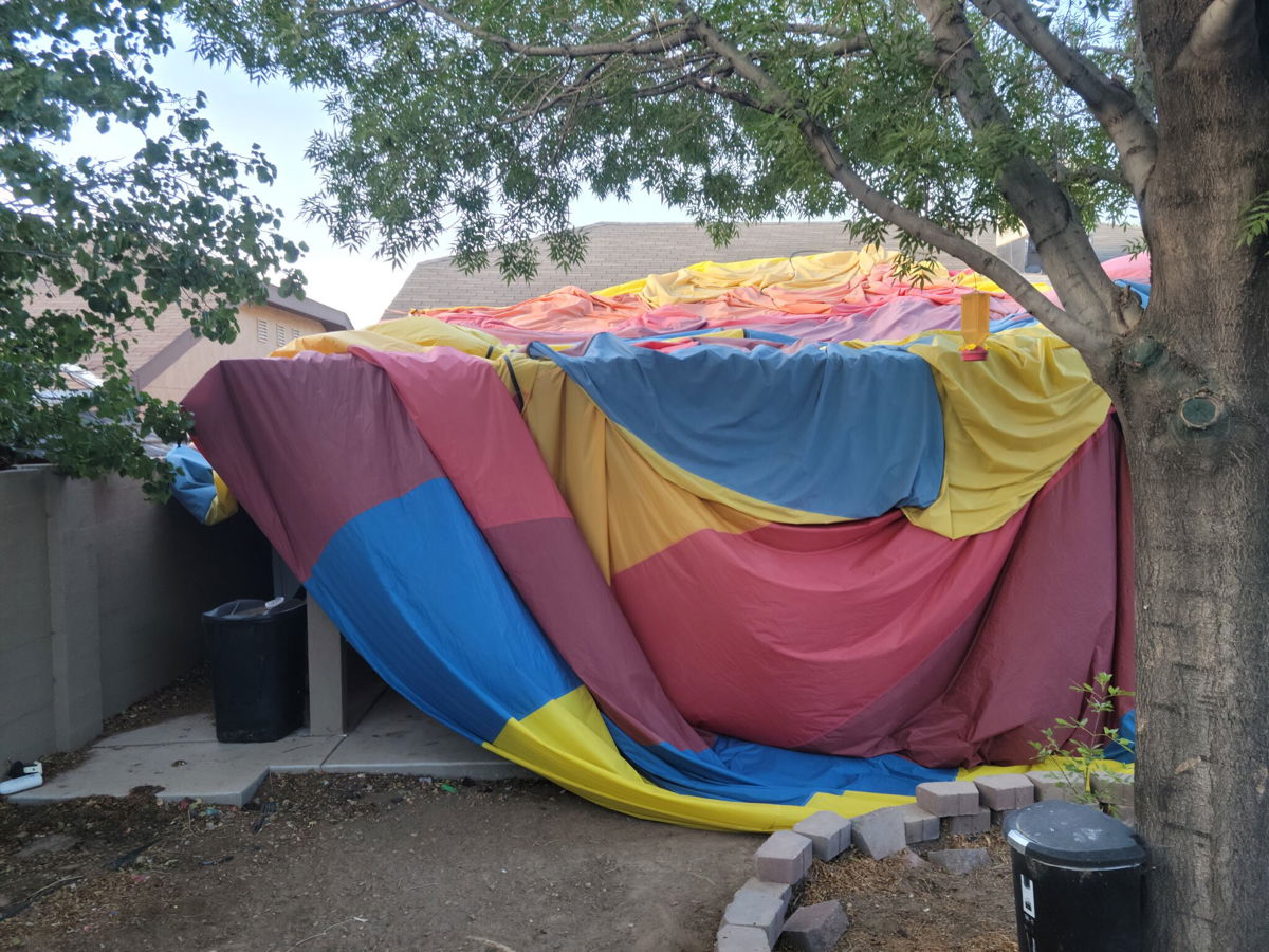 <i>Courtesy Austin Council</i><br/>Austin Council took this photo of the envelop of a hot air balloon that is covering a neighbor's house in Albuquerque