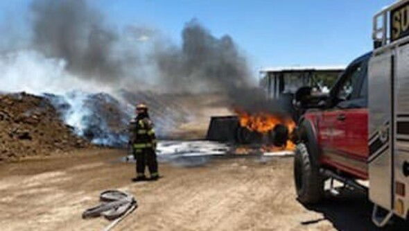 Sunland Park firefighters battle a front-end loader fire that was spreading.