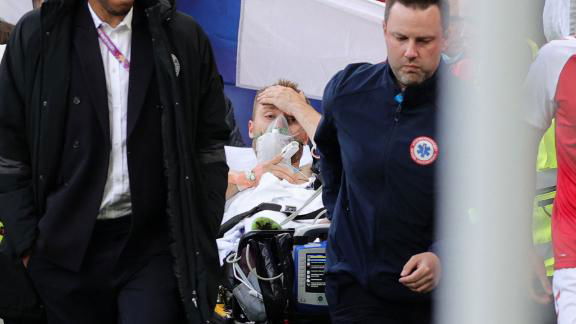 Danish soccer star Christian Eriksen being taken to the hospital.