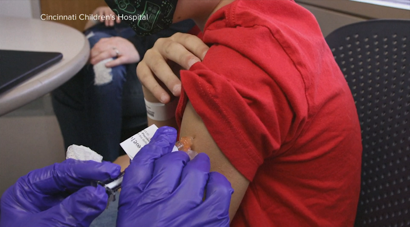 A child getting a vaccine. 