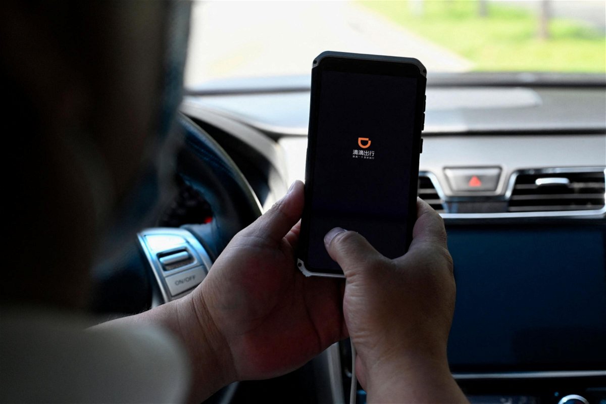 <i>Jade Gao/AFP/Getty Images</i><br/>A driver opens the Didi Chuxing ride-hailing app on his smartphone in Beijing on July 2.