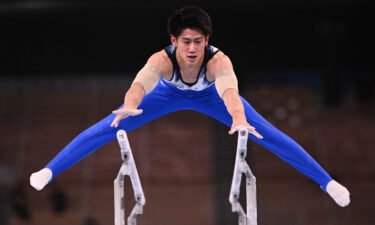Japan's Daiki Hashimoto competes in the parallel bars event of the artistic gymnastics men's all-around final during the Tokyo 2020 Olympic Games at the Ariake Gymnastics Centre in Tokyo on July 28