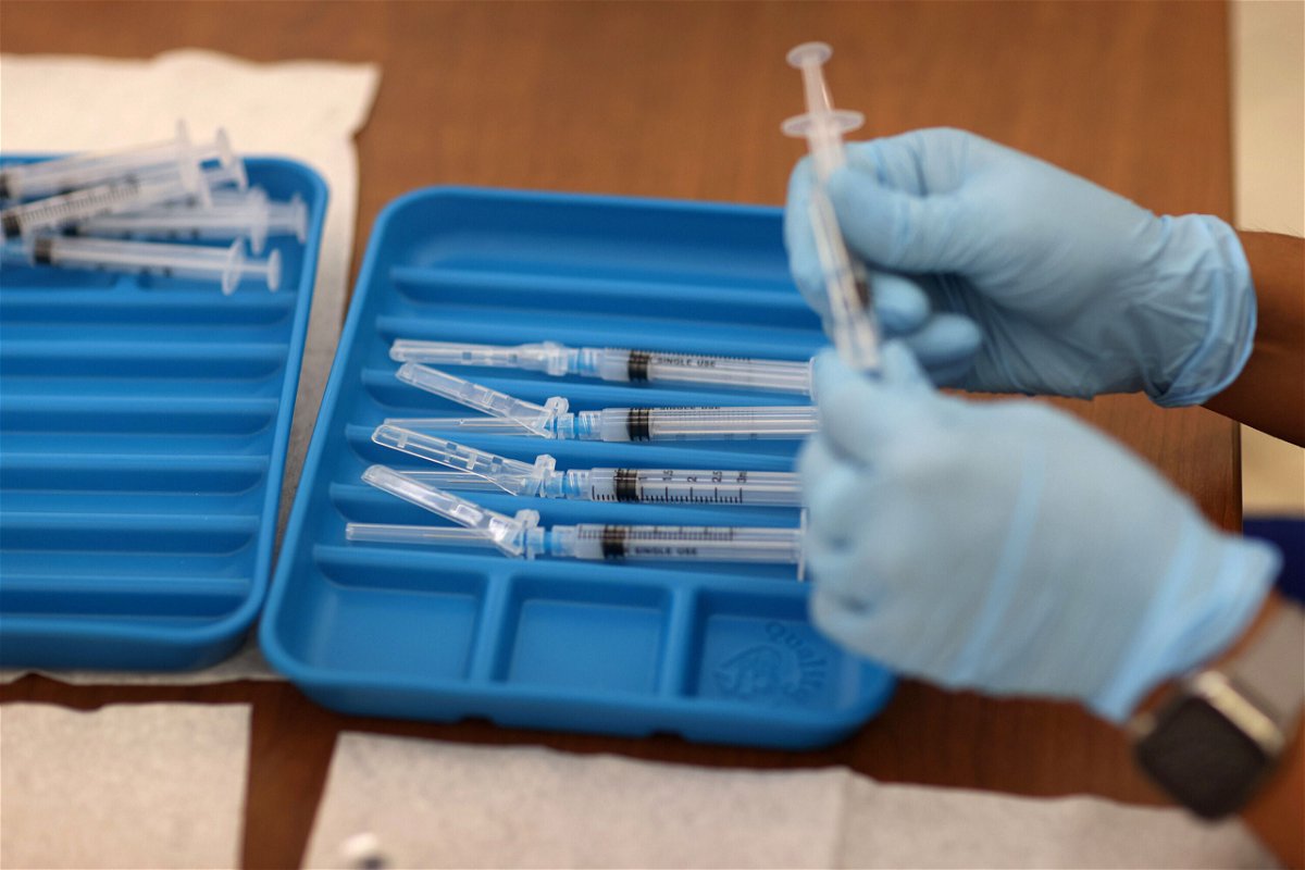 <i>Joe Raedle/Getty Images</i><br/>A healthcare worker prepares Moderna Covid-19 vaccines at a clinic set up by Healthcare Network on May 20 in Immokalee