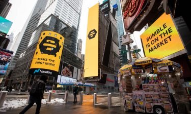 Monitors display Bumble Inc. signage during the company's initial public offering (IPO) in front of the Nasdaq MarketSite in New York on Thursday