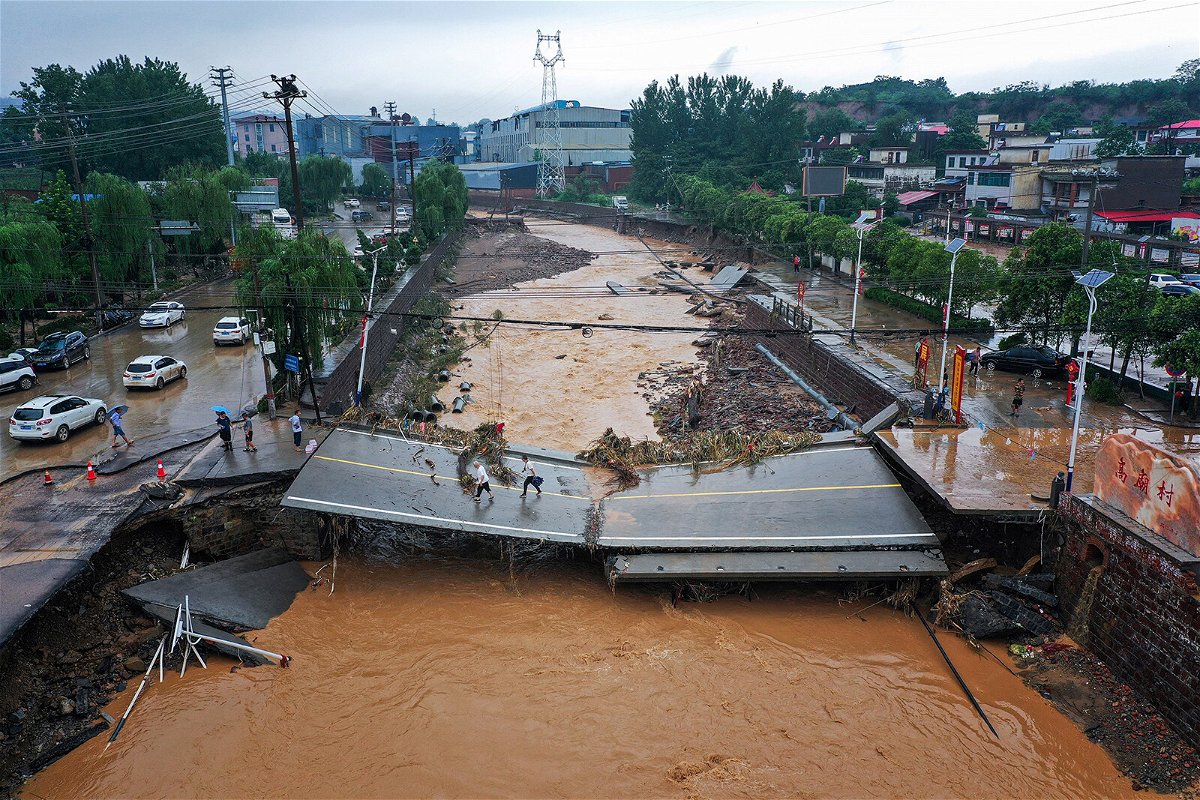 <i>STR/AFP/Getty Images</i><br/>A damaged bridge following heavy rains which caused severe flooding in Gongyi in China's central Henan province on July 21.