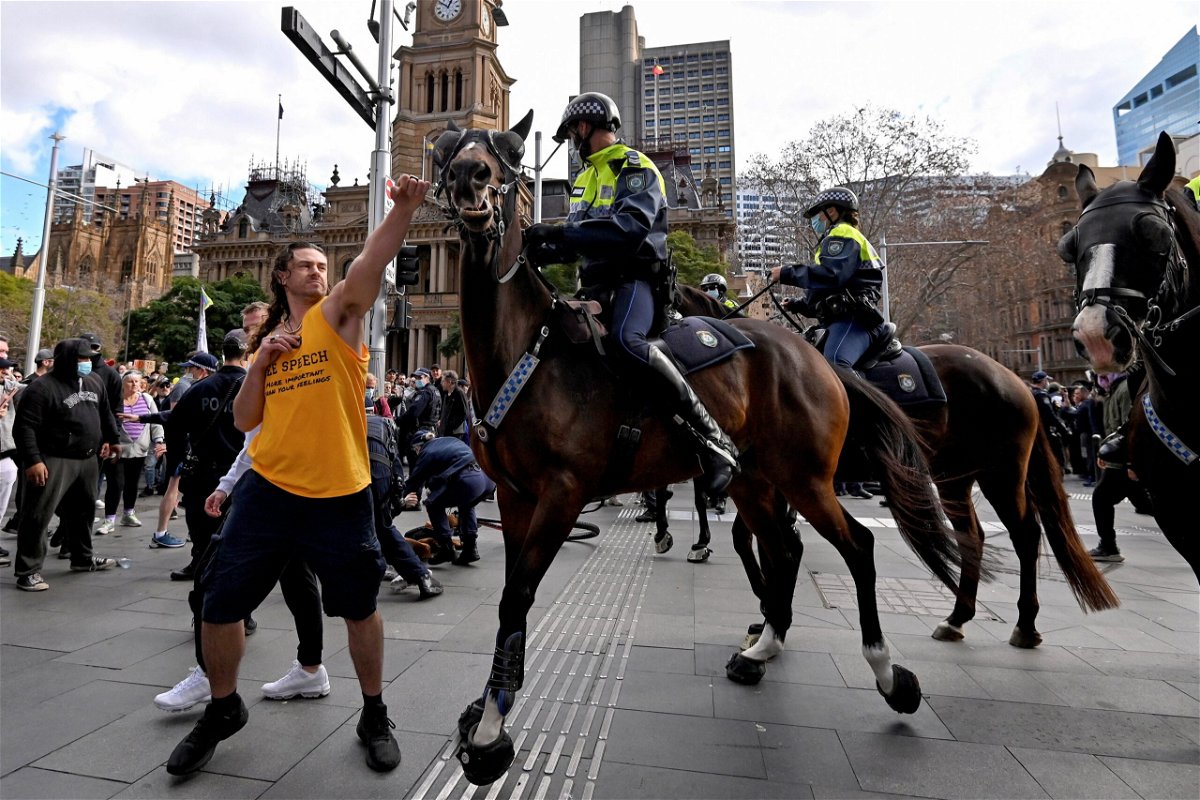 <i>Steven Saphore/AFP/Getty Images</i><br/>A protester tries to push away a police horse in Sydney on July 24