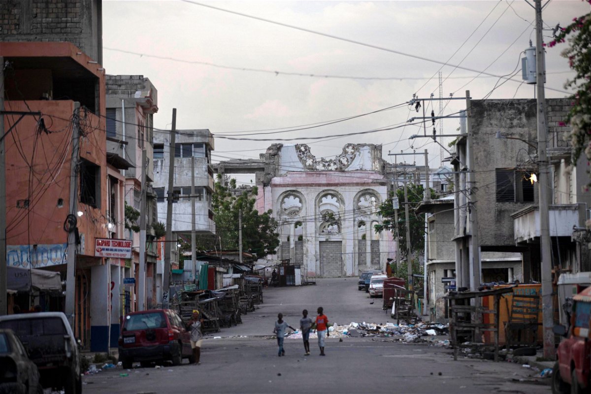 <i>Joseph Odelyn/AP</i><br/>Children walk on an empty street in front of the cathedral that was destroyed by the 2010 earthquake in Port-au-Prince