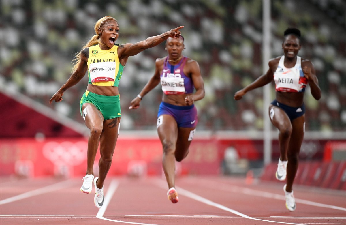 <i>Matthias Hangst/Getty Images AsiaPac/Getty Images</i><br/>Elaine Thompson-Herah celebrates as she wins 100m gold at the Tokyo Olympics.