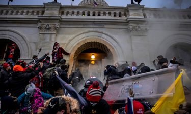 Trump supporters clash with police and security forces as people try to storm the US Capitol on January 6 in Washington
