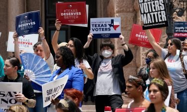 Demonstrators join a rally to protest proposed voting bills on the steps of the Texas Capitol