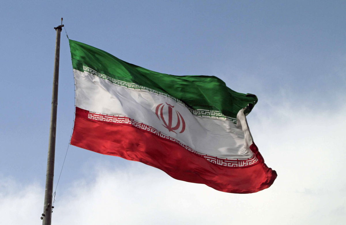 <i>Shutterstock</i><br/>An  Iranian flag flies in the wind.