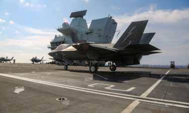 US Marine Fighter Attack Squadron 211 conducts flight deck operations onboard the Royal Navy aircraft carrier HMS Queen Elizabeth in the South China Sea on July 27.