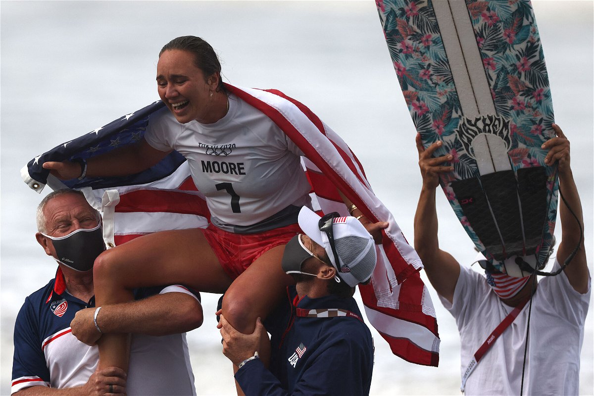 <i>Yuki Iwamura/AFP/Getty Images</i><br/>US's Carissa Moore celebrates after winning the women's Surfing gold medal final at the Tsurigasaki Surfing Beach