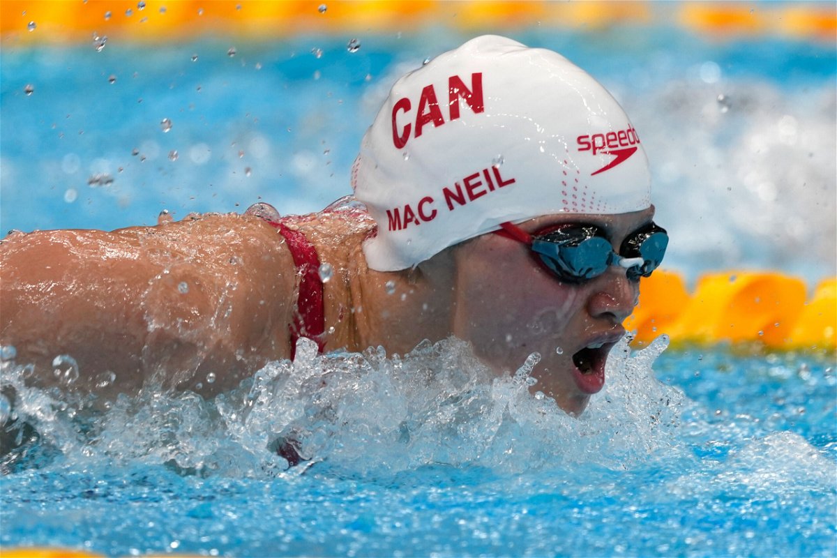<i>Martin Meissner/AP</i><br/>Canada's Margaret Macneil won the gold medal in the women's 100-meter butterfly at the Tokyo Olympics.