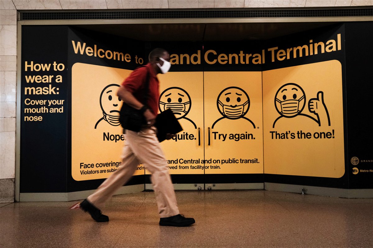 <i>Spencer Platt/Getty Images</i><br/>A person wears a mask while walking in Grand Central Terminal on July 27 in New York City.