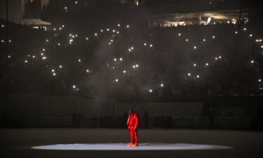 Kanye West took to the stage Thursday at Mercedes-Benz Stadium in Atlanta but he was silent