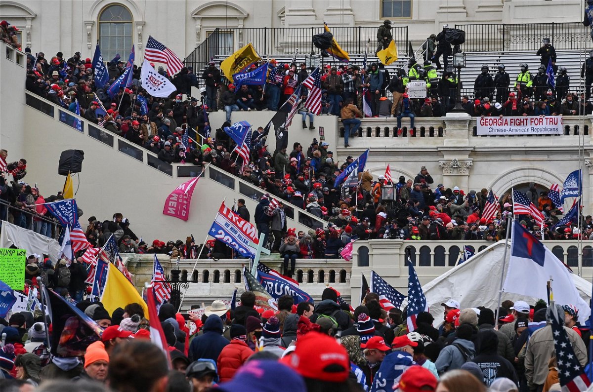 <i>Ricky Carioti/The Washington Post/Getty Images</i><br/> Rioters as they gathered outside the US Capitol on Jan. 6.