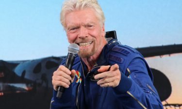 Richard Branson answers questions after successfully going to the edge of space on July 11.