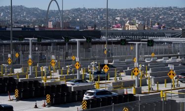 Vehicles enter a checkpoint as they approach the Mexico border at the US Customs and Border Protection San Ysidro Port of Entry at the US- Mexico border on February 19 in San Diego.