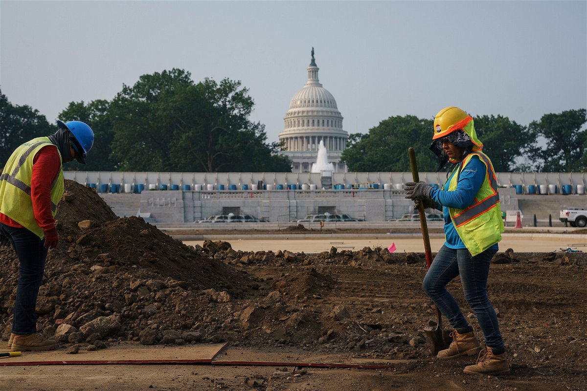 <i>J. Scott Applewhite/AP</i><br/>Workers repair infrastructure near the Capitol in Washington.