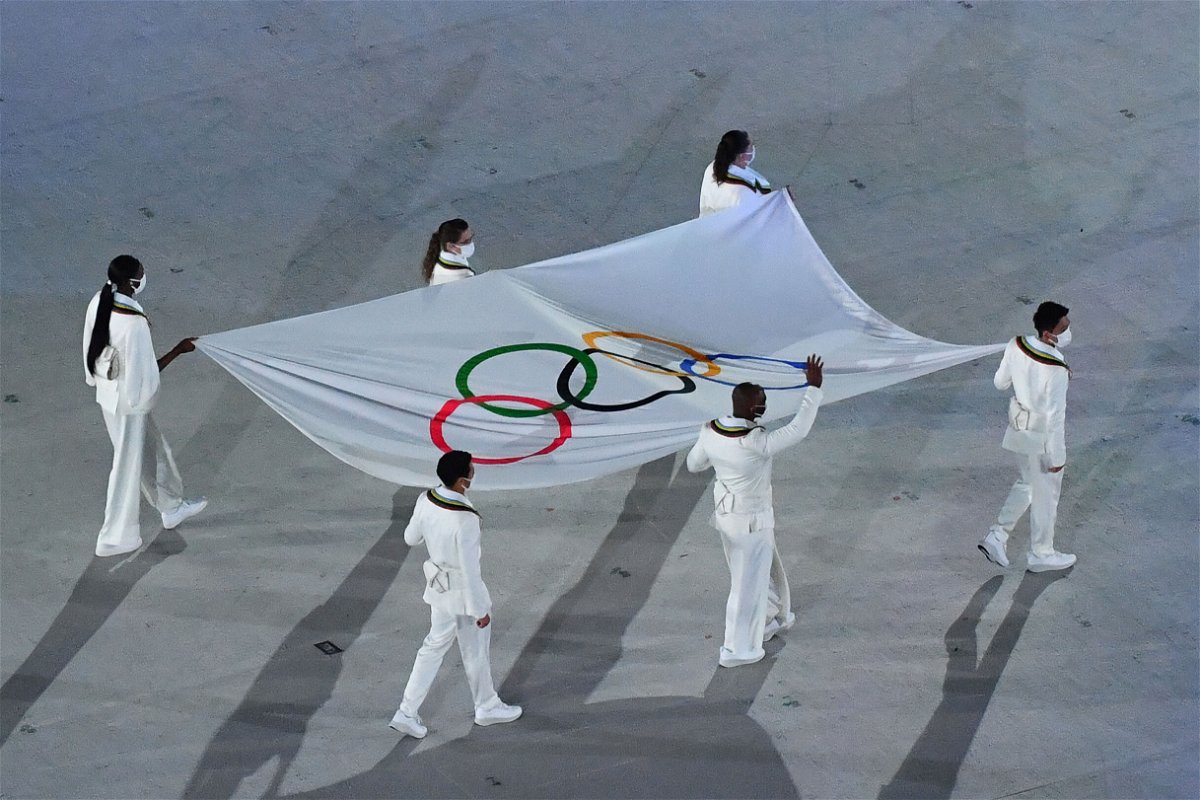 <i>Antonin Thuillier/AFP/Getty Images</i><br/>The Olympic flag is seen being carried during the opening ceremony of the Tokyo 2020 Olympic Games at the Olympic Stadium in Tokyo on July 23.