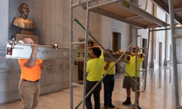 Workers prepare scaffolding at the Nathan Bedford Forrest bust in the State Capitol in Nashville