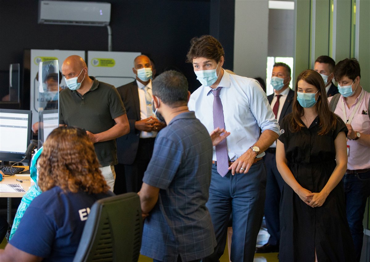 <i>Christinne Muschi/Reuters</i><br/>Canada's Prime Minister Justin Trudeau greets people as he visits a vaccination site in Montreal