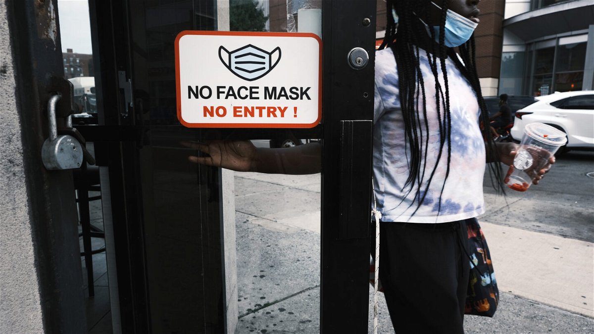<i>Spencer Platt/Getty Images</i><br/>A sign indicating face masks are mandated.