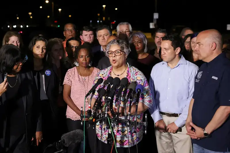 Democratic members of the Texas House of Representatives speak to reporters after arriving in Washington, D.C.