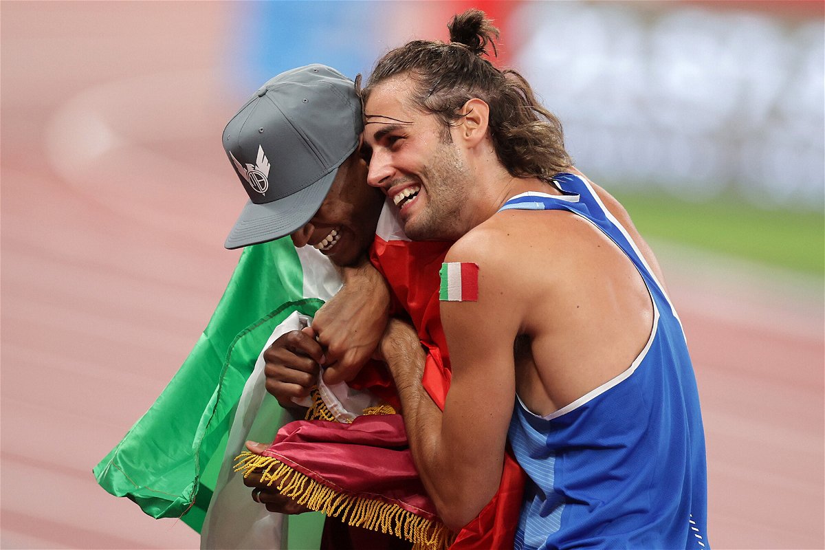 <i>Hannah Mckay/Reuters</i><br/>Mutaz Essa Barshim and Gianmarco Tamberi emotionally embrace after winning gold in the men's high jump in Tokyo.