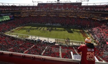 Washington fans stand in the upper deck at FedExField in Landover