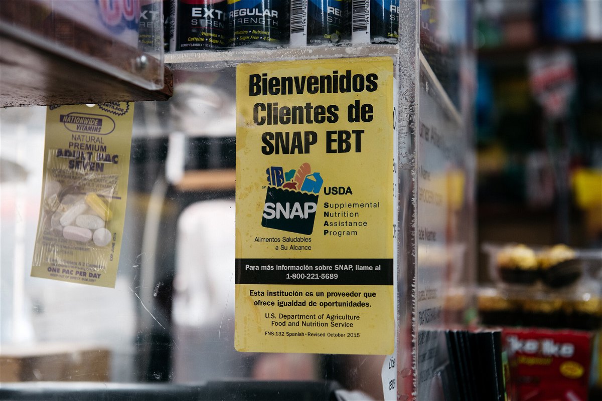 <i>Scott Heins/Getty Images</i><br/>A sign alerting customers about SNAP food stamps benefits is displayed in a Brooklyn grocery store in New York City.
