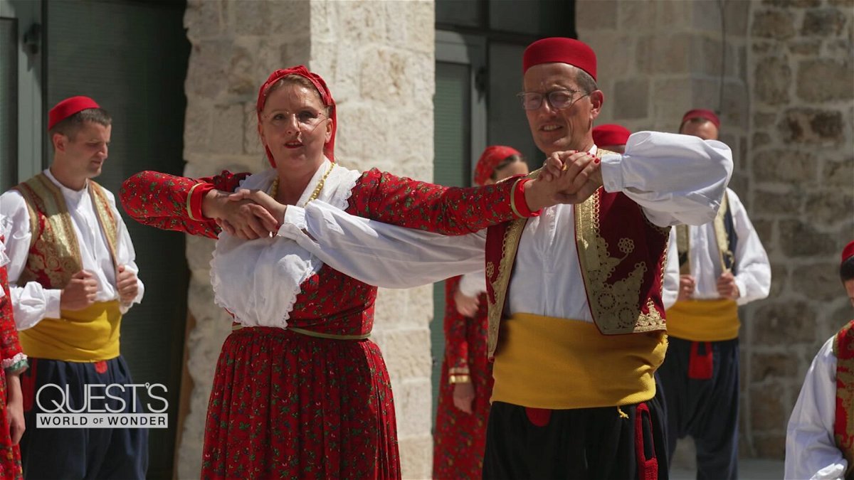 <i>CNN</i><br/>Jelica Čučević shows Richard Quest some traditional dance moves.