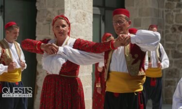 Jelica Čučević shows Richard Quest some traditional dance moves.