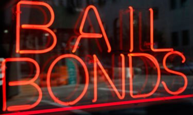 FILE - This file photo shows a sign advertising a bail bonds business in the Brooklyn borough of New York.