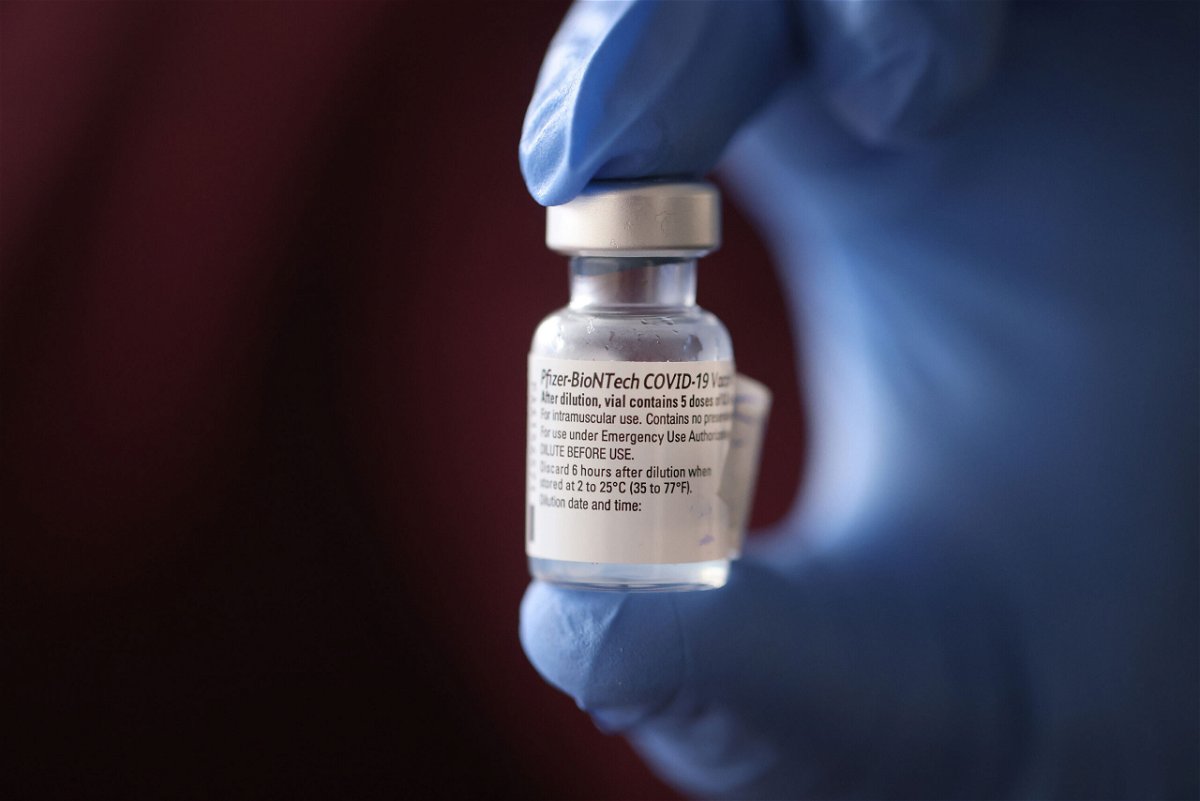 <i>Scott Olson/Getty Images</i><br/>A nurse shows a container of Pfizer-BioNTech COVID-19 vaccine after it was used to vaccinate the first five staff members at Roseland Community Hospital on December 17