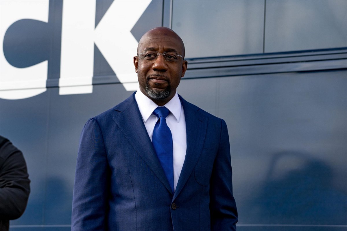 <i>Megan Varner/Getty Images</i><br/>Then-Georgia US Senate Democratic Candidate Rev. Raphael Warnock meets with supporters on January 5