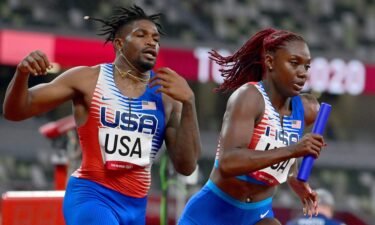 USA's Elija Godwin and Lynna Irby compete in the mixed 4x400m relay heats during the Tokyo 2020 Olympic Games on July 30.