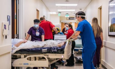 Texas health officials warn of full ICUs as the state grapples with a worsening Covid-19 surge. Nurses and EMTs tend to patients in hallways at the Houston Methodist The Woodlands Hospital on August 18