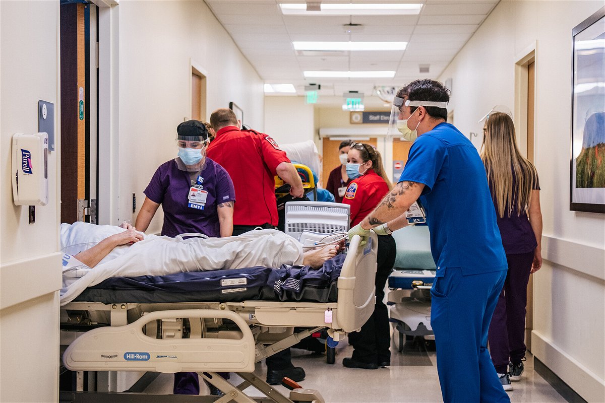 <i>Brandon Bell/Getty Images</i><br/>Texas health officials warn of full ICUs as the state grapples with a worsening Covid-19 surge. Nurses and EMTs tend to patients in hallways at the Houston Methodist The Woodlands Hospital.