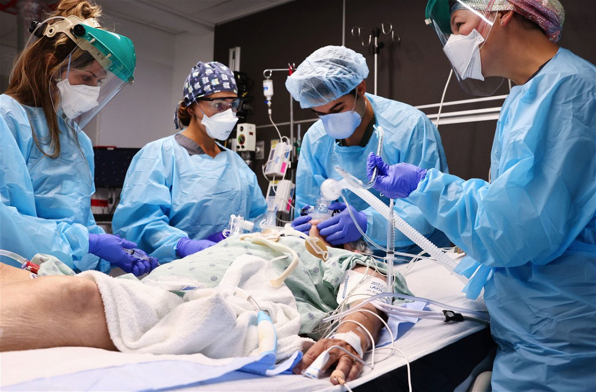 <i>Mario Tama/Getty Images</i><br/>Clinicians work on intubating a Covid-19 patient in the Intensive Care Unit at Lake Charles Memorial Hospital in Lake Charles