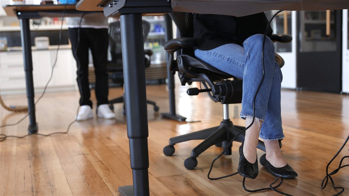 <i>Justin Sullivan/Getty Images</i><br/>Employees at tech startup company Fast work at their desks in the office on March 24